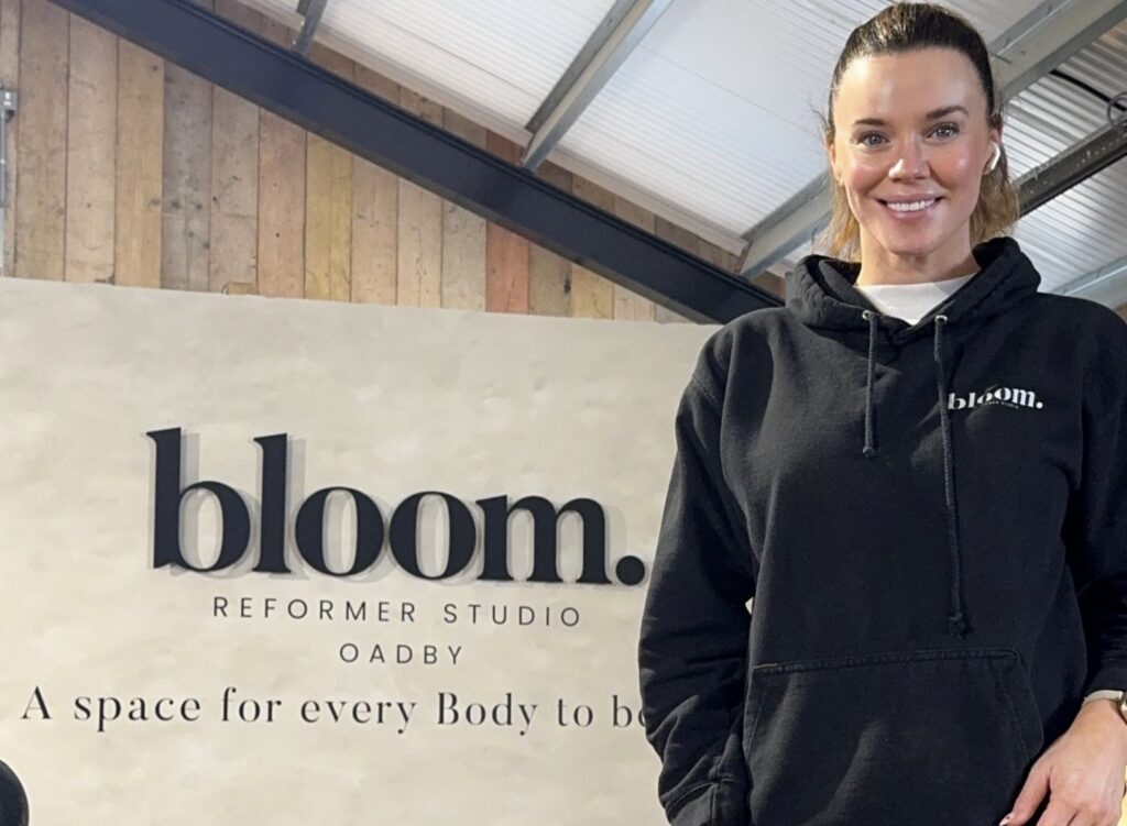 Maria Fowler ouside Bloom Reformer Studio